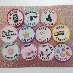 embroidered badges with words and pictures on them