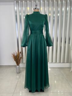 Made from 100% organza chiffon fabric.  product weight is 550 grams.  It is a lined dress.  It is 152 centimeters long. Green Chiffon Evening Dress For Wedding Guest, Green Organza Evening Dress For Banquet, Green Organza Evening Dress, Green Organza Evening Dress For Wedding, Long Sleeve Organza Gown For Banquet, Green Chiffon Maxi Dress For Banquet, Elegant Long Sleeve Organza Evening Dress, Green Long Sleeve Chiffon Evening Dress, Green Floor-length Dress With Sheer Sleeves