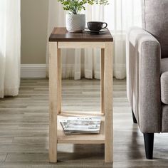 a small table with a magazine on it next to a couch