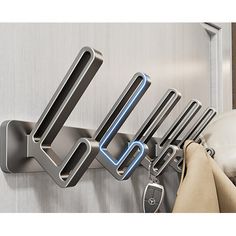 an image of a kitchen rack with utensils hanging on it