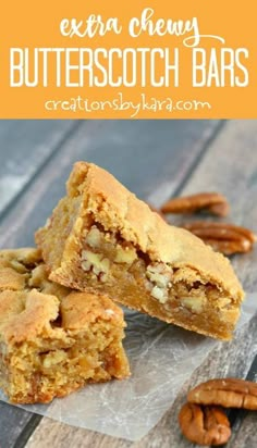 two pieces of butterscotch bars stacked on top of each other with pecans in the background