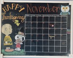 a chalk board with a drawing of a thanksgiving calendar and an owl sitting on it