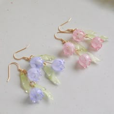 Crafted from shrink plastic, these earrings feature delicate lily of the valley flowers in light blue and light pink. Their gentle and lovely design adds a touch of elegance to your style. Embrace the charm of nature with our Lily of the Valley Earrings. M A T E R I A L S * A N D * S I Z E  - Length: 35mm - Width: 25mm Available in Gold Finish!  Ear Wires: 925 sterling silver Cheap Light Blue Flower Earrings For Gift, Clothes Made From Nature, Shrinking Plastic Earrings, Cute Earring Ideas, Lily Of The Valley Earrings, Baby Blue Earrings, Fairy Jewellery, Pink Earring, Anting Manik