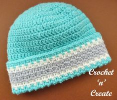 a crochet hat is sitting on a table with the words crochet n'create written below it