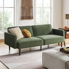 a living room scene with focus on the couch and coffee table in the foreground