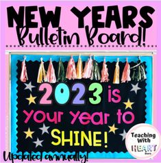 the new year bulletin board has been decorated with stars and tassels on it