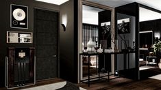 a room with black walls and wooden floors