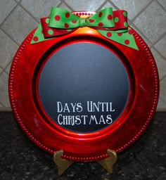 a red plate with a green bow on it that says days until christmas