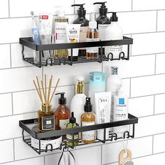 two metal shelves with soaps, lotions and other items on them in a bathroom