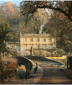 an old house in the middle of a wooded area