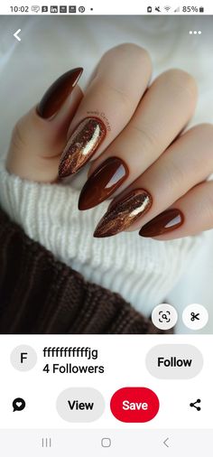 the nails are brown and gold with some glitter on them, but it's not too