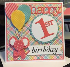 a happy 1st birthday card with balloons and a teddy bear on the front that says happy 1st