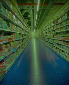 an aisle in a grocery store filled with lots of shelves and food on the floor