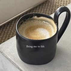 a black coffee mug with the words bring me to life on it's side