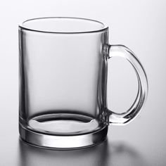 a glass mug sitting on top of a table