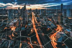 an aerial view of the city at night with lines and dots overlaiding it