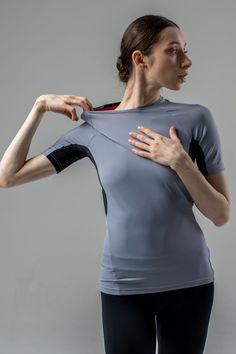 Design. Grey women's rash guard t-shirt with an anatomical fit. Tight, secure fit on the body. Seam placement provides maximum comfort for wide amplitude movements of arms and torso. Grey dance stretch T-shirt for women. Material. Italian biflex - elastic, highly durable, dries quickly, doesn't deform. NB Sweat is less visible on more vibrant and darker colours. Design and technology consider the intensity of dancing and sport activities. Ballet Yoga, Dance Stretches, Sport Activities, Design And Technology, Rash Guard Women, Sports Activities, T Shirt For Women, Grey Women, Rash Guard