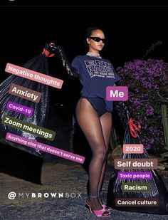 a woman is holding two bags and posing for the camera with her name tag on it