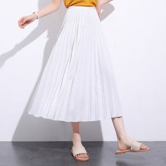 Exude elegance and class in our Solid Pleated Ankle Length Skirt. Featuring a long fit and elasticated waistband, this skirt is sure to keep you feeling comfortable and looking stylish all day long. Perfect for everyday wear, this versatile piece may be paired with a sweater or blouse for an effortlessly chic look to wear for casual days out or informal settings. Spring Full Maxi Skirt With Elastic Waistband, Casual Fitted Ankle-length Maxi Skirt, Fitted Ankle-length Casual Maxi Skirt, Spring Midi Pleated Skirt With Elastic Waistband, Spring Flared Pleated Skirt With Elastic Waistband, Spring Elastic Waistband Flared Pleated Skirt, Stretch Flared Skirt With Elastic Waistband, High Waist Accordion Pleats Skirt For Spring, High Waist Stretch Pleated Skirt