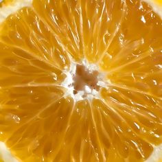 an orange cut in half sitting on top of a table