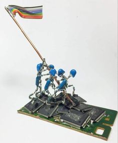 a group of people holding a flag on top of a motherboard