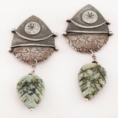 Awaiting your purchase is a pair of artisan sterling silver dangle earrings crafted by vintage maker in this wonderful leaf motif design featuring green carved agate. This special set remains in Excellent condition. Length: 58.9 mm Width: 29.4 mm Stone Dimensions (MM): 21 x 16 mm Weight: 11.5 g ------------------------------- TERMS OF SERVICE: - All of our stones are natural earth mined stones, unless stated otherwise. -We have tested all stones & metals that we identify and guarantee their puri Bohemian Carved Sterling Silver Jewelry, Nature-inspired Carved Sterling Silver Jewelry, Green Artisan Jewelry With Oxidized Finish, Artisan Green Jewelry With Oxidized Finish, Green Leaf-shaped Sterling Silver Earrings, Green Oxidized Artisan Jewelry, Carved Sterling Silver Earrings, Artisan Green Pierced Jewelry, Green Artisan Pierced Earrings