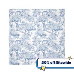 a blue and white blanket with an image of animals on it, in front of the words 30 % off site divider