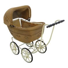 a wicker baby's pram is shown on a white background