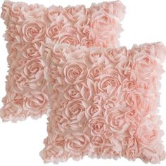 two pink pillows with roses on them