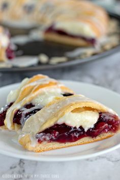 two plates with pastries on them sitting on a table