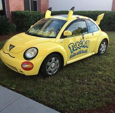 a yellow car that has been painted to look like pokemon pikachu on it