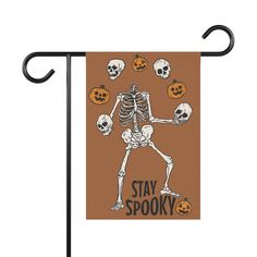 a halloween skeleton with pumpkins on it and the words stay spooky