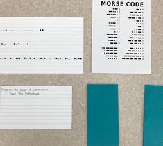 three pieces of paper and some type of code on a table next to each other