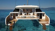 a large white boat floating on top of the ocean