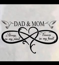 the words dad and mom are written in black ink on a white paper with two hearts