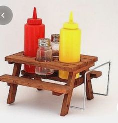 a miniature picnic table with condiments on it