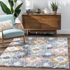 a living room with a blue chair and white rug in front of a wooden dresser