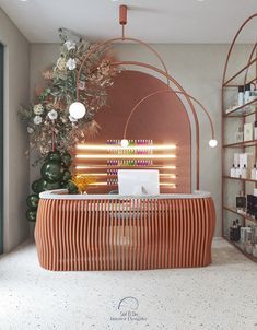 the interior of a nail salon with an orange counter top and white flowers on display