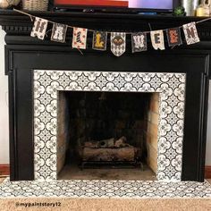 a decorated fireplace with an owl banner hanging over it