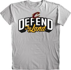 a t - shirt that says defend the land in black and yellow letters on it