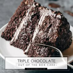 a slice of triple chocolate cake on a white plate with the words triple chocolate out of the box cake