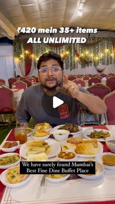 a man sitting at a table full of food with the caption, we have surely found mumbai's best fine dinner buffet place