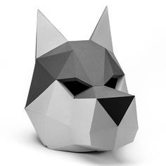 an origami cat head is shown on a white background with black and grey details