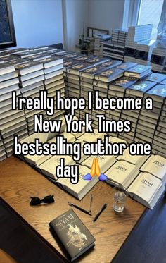 a pile of books sitting on top of a wooden table