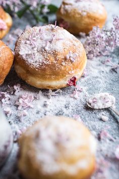 powdered donuts with sprinkles and pink flowers