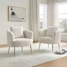 two white chairs sitting on top of a rug in a living room next to a window