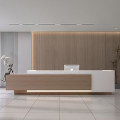 an empty reception area with white and wood furniture