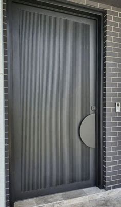 a black door with a round handle on it