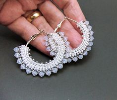 I made these lovely big beaded hoop earrings with tiny miyuki seed beads in white pearl and galvanised silver, beading round lovely great big silver plated hoops, and finishing with a row of stunning shimmering white opal premium crystal bicone beads. The beaded hoops measure 4.5 cm across (2 inches).   These stunning White Opal hoop earrings come in their own gift box, to reach you safely and securely. FREE SHIPPING with the UK White Hoop Jewelry With Tiny Beads, White Small Hoop Earrings With Tiny Beads, White Beaded Hoop Earrings With Tiny Beads, White Earrings With Tiny Beads, Silver Beaded Earrings With Spacer Beads, White Small Hoop Beaded Earrings With Tiny Beads, Silver Beaded Earrings With Tiny Round Beads, White Small Hoop Beaded Earrings Nickel Free, White Hoop Jewelry For Jewelry Making