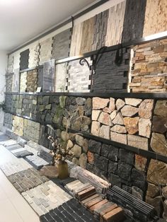 a room filled with lots of different types of tiles and flooring materials on display